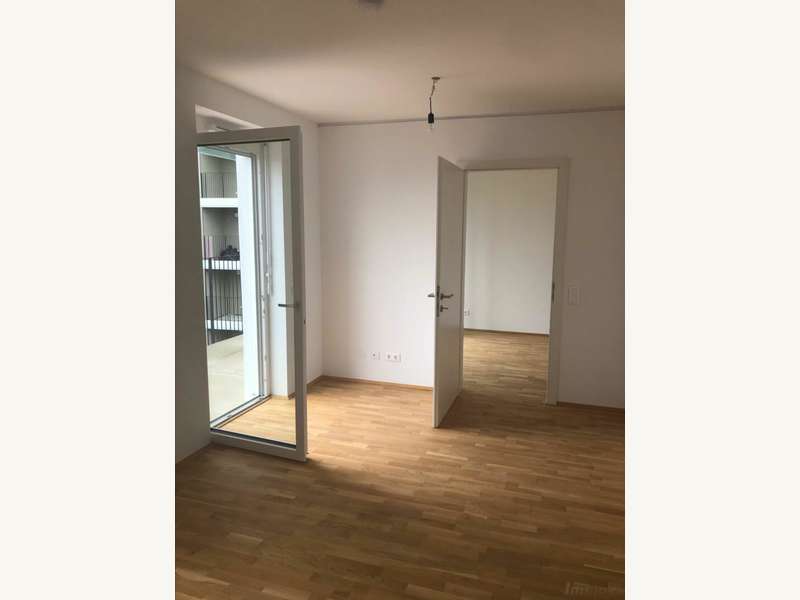Penthouse Graz: Wohnzimmer mit Blick zum Schlafzimmer Wohnzimmer mit Blick zum Schlafzimmer